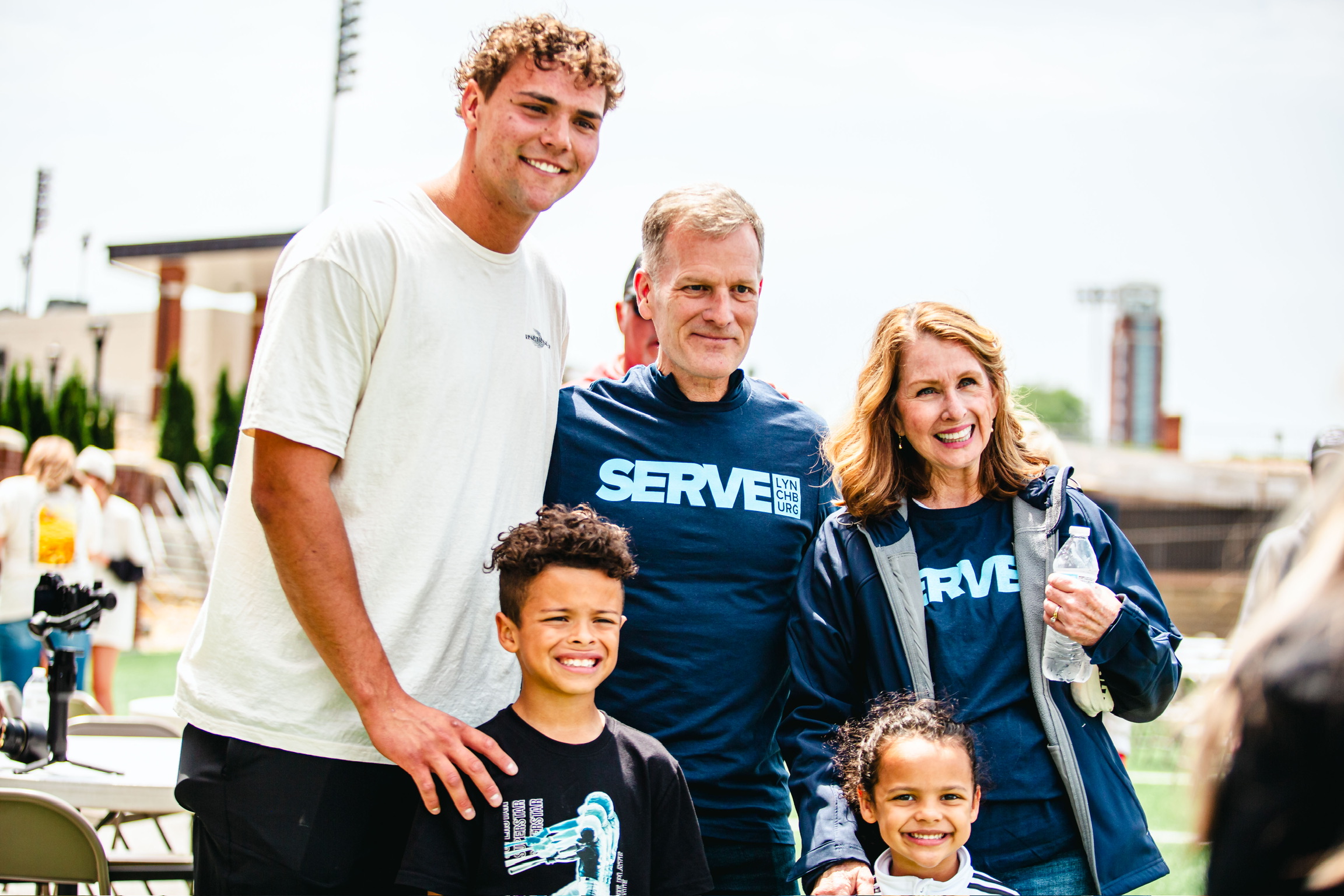 Reap the Harvest camp, coaches and kids on the football field